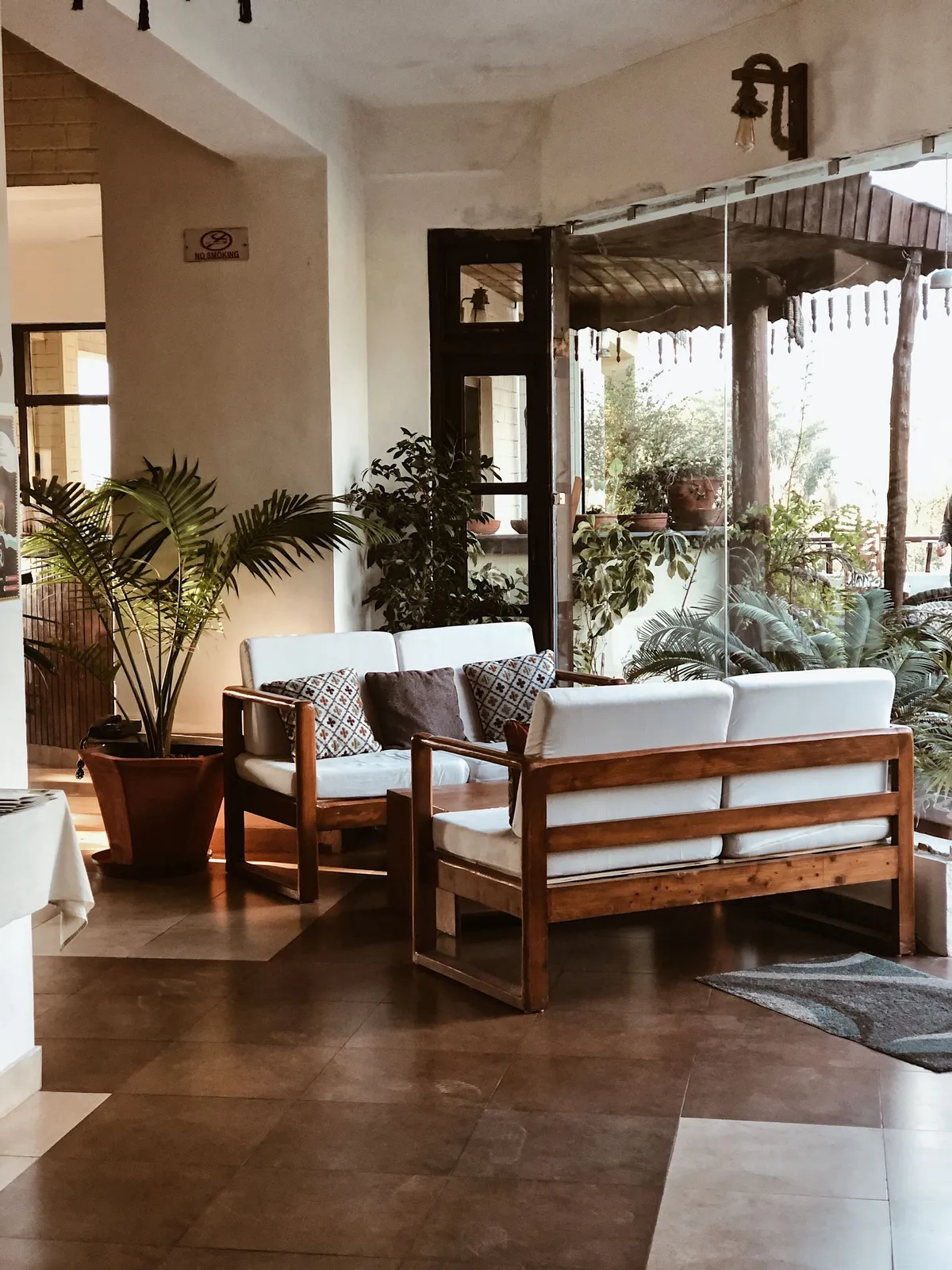 A warm teak and rattan living room